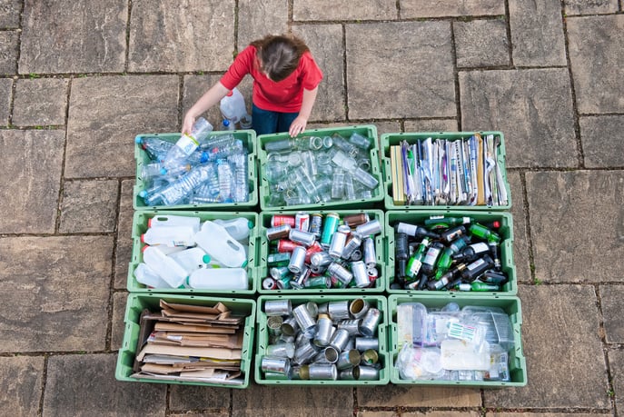 Young Girl Sorting Recycling